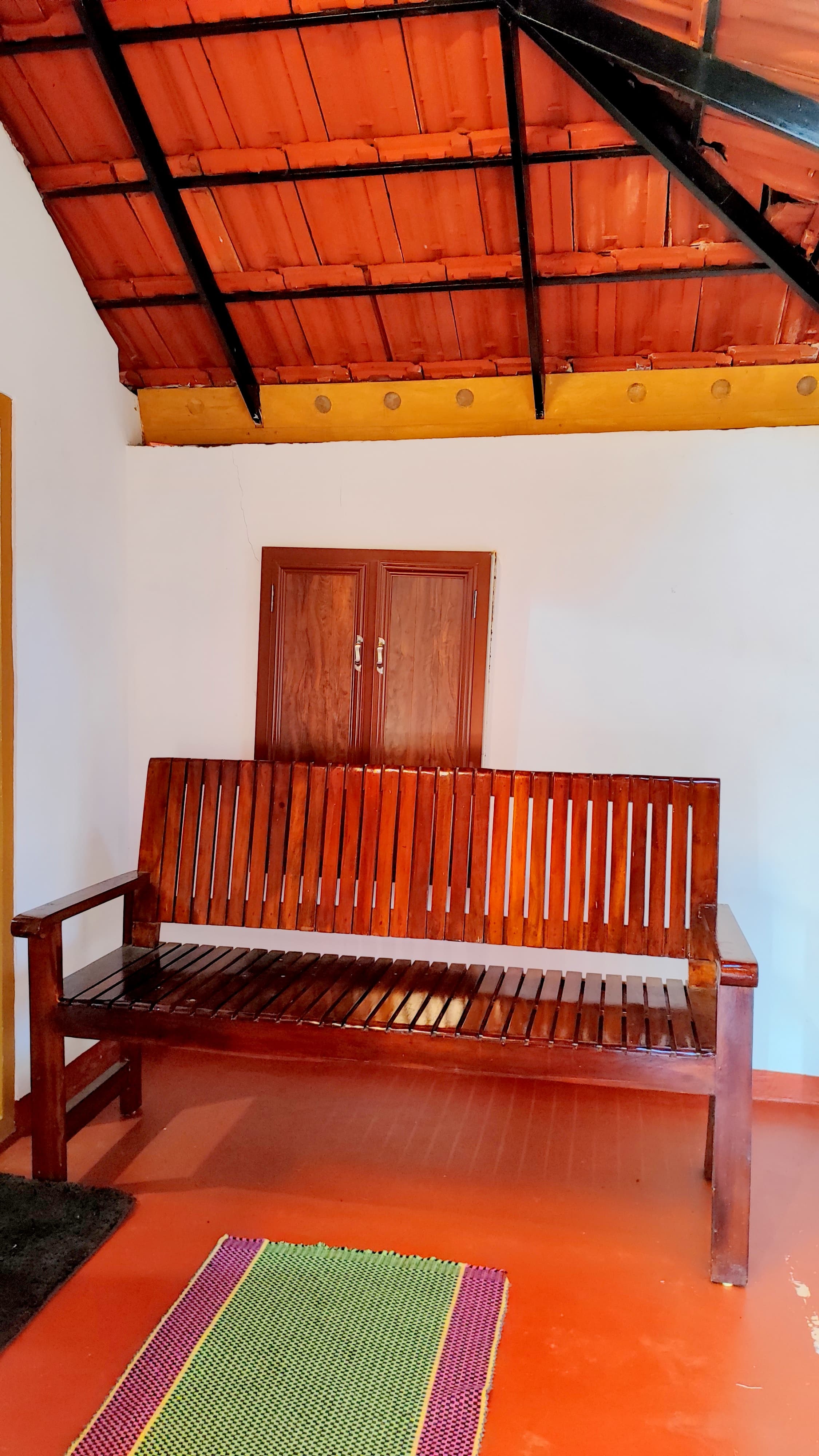 Interior with Wooden Bench and Traditional Roof